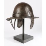 An English Civil war 'lobster pot helmet', circa 1650,  with two-piece skull, pointed pivoted fall