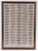 A 19th century sampler, with five rows of blue and red flowers, 33cm wide, 48cm high Chris