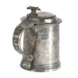 A rare Charles II pewter flat-lid tankard, circa 1680 Having a plain drum, the lid with front
