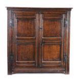 A Charles I oak food hutch/cupboard, circa 1640, the rectangular top above a pair of doors, each