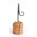 A George III wrought iron and fruitwood rushlight holder, circa 1800, pointed nips, circular stem