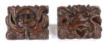 Two early17th century oak panels, English, circa 1600, each carved with a  Green Man mask, 16.5cm