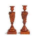 An interesting pair of George III yew and burr yew candlesticks, circa 1790, of sectional screw-