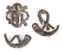 A 14th century pewter pilgrim's badge, designed as Christ on the cross within a barbed quatrefoil
