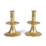 A rare pair of mid-17th century brass alloy trumpet-based socket candlesticks, English, circa 1650