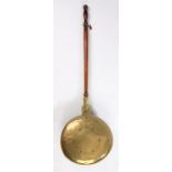 18th Century brass bed warmer, the turned handle attached to the brass hinged domed lid with a