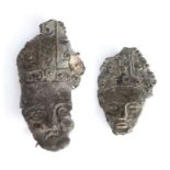 Two 14th century pewter pilgrims' badges, each designed as the head of St. Thomas Becket,  wearing