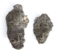 Two 14th century pewter pilgrims' badges, each designed as the head of St. Thomas Becket,  wearing