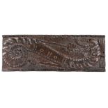 A characterful  Elizabeth I carved oak panel, designed as a curled dragon, with  open mouth, 54cm