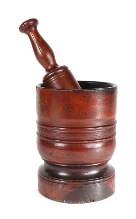 An early 18th century lignum vitae mortar, English, circa 1700-20 Of ring-turned cylindrical form,