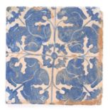 A 16th century blue and white sgraffito tile, Catalan, Spain, designed with adorsed mythical beasts