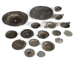 A group of 16th/17th century pewter toy plates and dishes To include a broad rim charger, examples