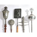Four 19th century pewter maces To include one in the form of a lidded chalice, another a sun burst,