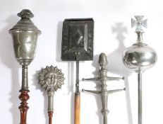 Four 19th century pewter maces To include one in the form of a lidded chalice, another a sun burst,
