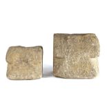 Two graduated stone mortars, English, 17th century or possibly earlier, both with rounded rims and