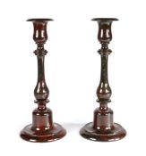 A pair of late19th century Cornish serpentine candlesticks Each of red and dark green mottled