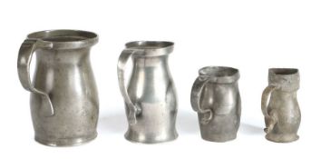 Four pewter lidless baluster measures, English, circa 1800-40 To include a pint example with crowned