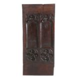 A 15th century large carved door panel, English circa 1480, designed with two blind-tracery arches