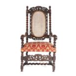 A late 17th Century walnut and cane open armchair, English, circa 1685, the pierced and carved top