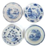 A group of four 18th Century Delft plates, one designed with a willow tree against a river, 23cm