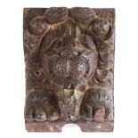 An unusual carved oak lion corbel, circa 1600-20, with a curled mane, prominent muzzle and open