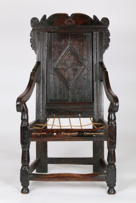 Charles II joined oak panel-back open armchair, Yorkshire, circa 1670, the back panel carved with - Image 4 of 6