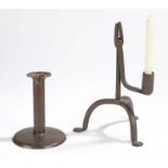 An iron table rushlight and candle holder, the square-ended jaws above the folded candle socket, on
