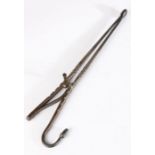 A pair of late 18th century steel ember tongs, with sprung arm and circular cup ends, with acorn