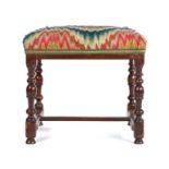 A walnut and  bargello upholstered stool, circa 1700, the rectangular stuff-over seat upholstered