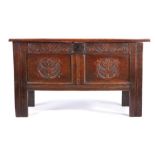 A Charles II oak coffer, circa 1660, the triple panelled lid,  enclosing storage space and open