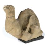 A 15th Century 'Hunkypunk' carved stone grotesque, West Country, carved as a reclining beast, 35cm