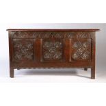 A Charles I joined oak coffer, Somerset, circa 1640 Having a triple-panelled lid, the front again of