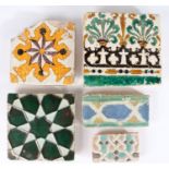 A 17th century tile, Spanish, Moorish star design in dark green lustre, together with a black and