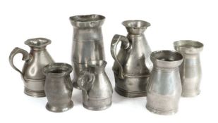 Three pewter haystack measures, Irish Half-pint, gill and noggin; together with four Irish lidless