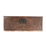 A Charles I oak boarded box, circa 1640, the rectangular hinged top with chip carved edge, the