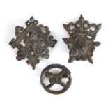 A 15th century pewter pilgrim/secular badge, designed as a crowned rose; another centred by a rose