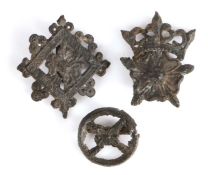 A 15th century pewter pilgrim/secular badge, designed as a crowned rose; another centred by a rose