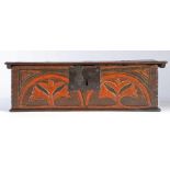 A rare Charles II boarded oak and stained box, Dorset, circa 1660 The frieze carved with two bold