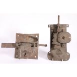 Two 16th/17th century iron locks, the first with a square plate and key, the plate 16.5cm long, the