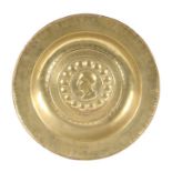 A rare 16th century brass alms dish, Nuremberg, circa 1500-1550 Centred by a profile of a ‘Roman