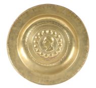 A rare 16th century brass alms dish, Nuremberg, circa 1500-1550 Centred by a profile of a ‘Roman