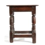 Charles II oak joint stool, the rectangular top above a moulded edge on turned legs united by