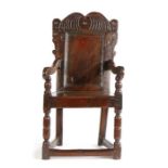 An interesting Charles I joined oak panel back open armchair, Yorkshire, Circa 1630, having a
