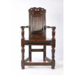 A rare James I/Charles I joined oak caqueteuse armchair, Aberdeenshire, circa 1610-30, the