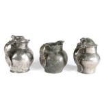 Two George III pewter lidded ale jugs, circa 1800 One with solid chair-back thumbpiece and overlap