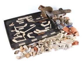 A collection of excavated items, to include clay pipe sections from the 16th to 19th Century, three