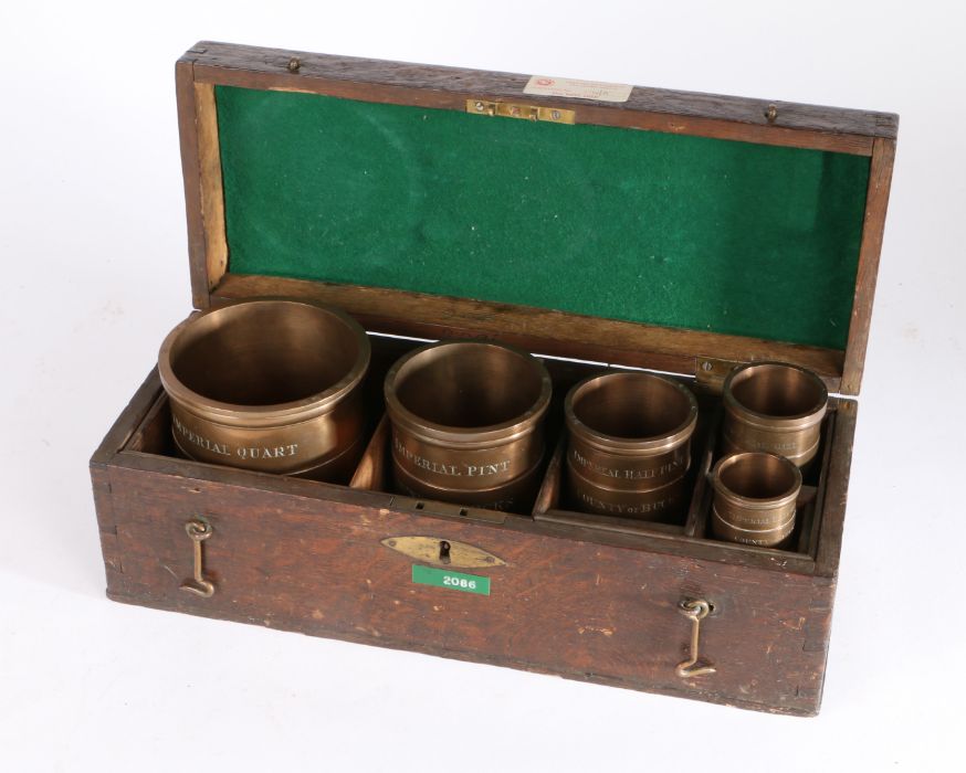 A Victorian 'gunmetal' Imperial Standard set of five cased measures, Buckinghamshire, each rim - Image 2 of 4