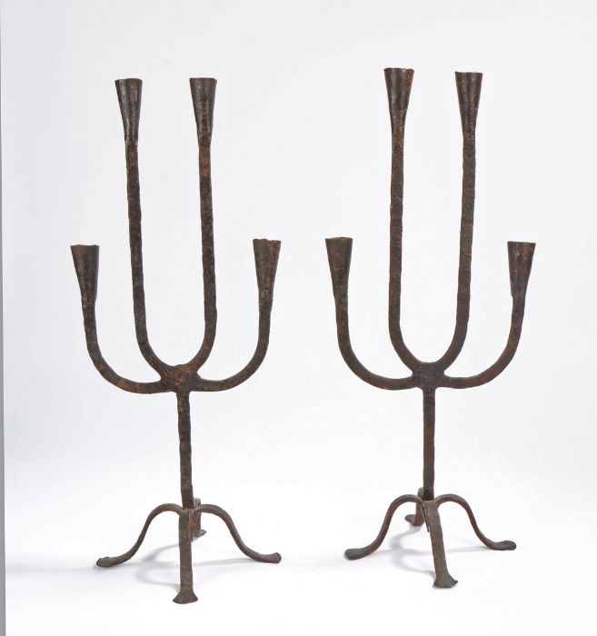 A pair of wrought iron candelabra, each with four arms with conical socket, on a tripod base, 53cm - Image 2 of 2