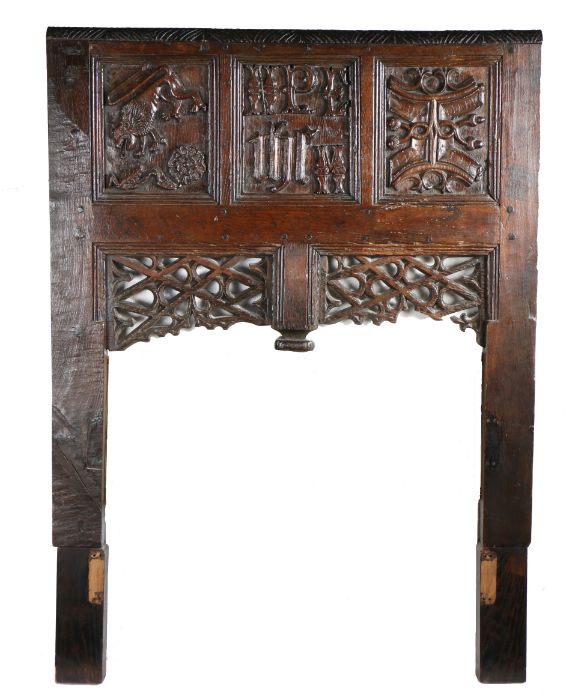 A well-carved oak headboard, of three early 16th Century panels, Welsh Borders A lion above a rose