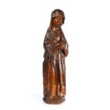 A rare mid-15th century carved oak figure of Mary Magdalen, English, probably Norfolk or Suffolk,